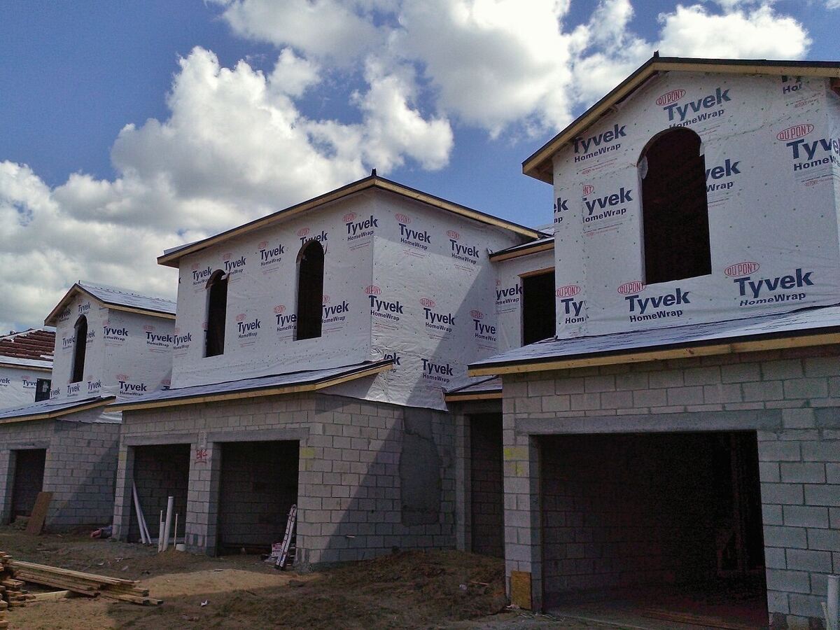 New two-story homes wrapped in Tyvek house wrap during construction