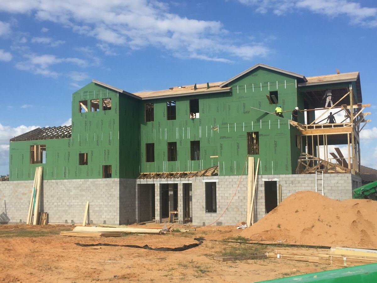 Three-story new home with green ZIP System wall sheathing during construction